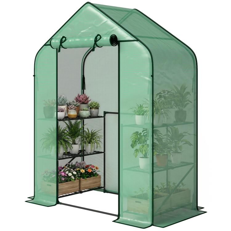 Portable green greenhouse with open front door and metal shelf frame