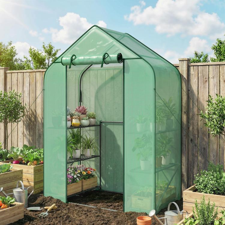 Portable green greenhouse with multiple shelves and open front access