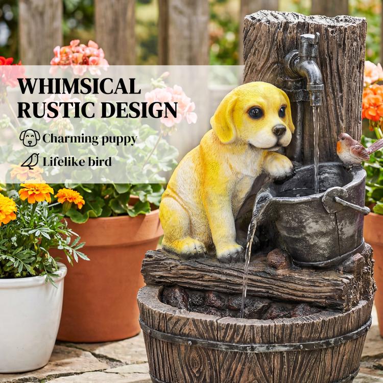 Yellow puppy and bird figures on a rustic three-tier resin fountain with water flow.