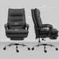 Black massage office chair with padded headrest, armrests, and footrest.