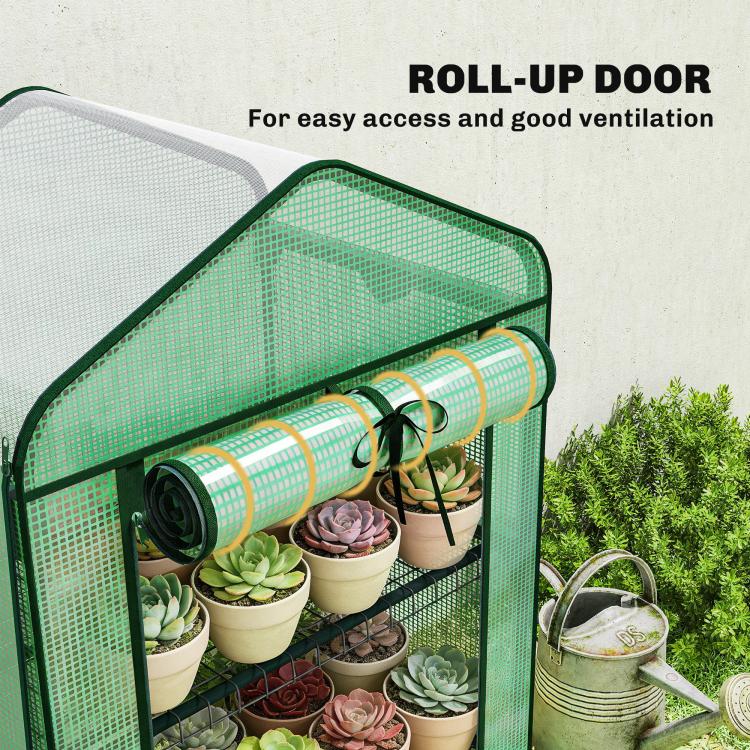 Green mini greenhouse with rolled-up zipper door and cylindrical PE cover roof