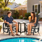 Two black mesh rocking glider chairs with armrests beside outdoor table near pool