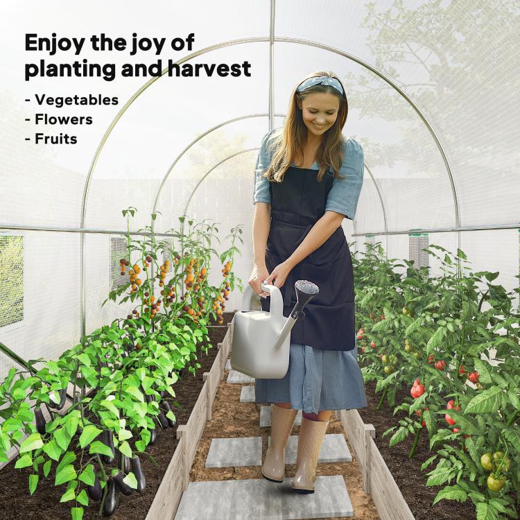 White walk-in tunnel greenhouse with arched frame and roll-up mesh door