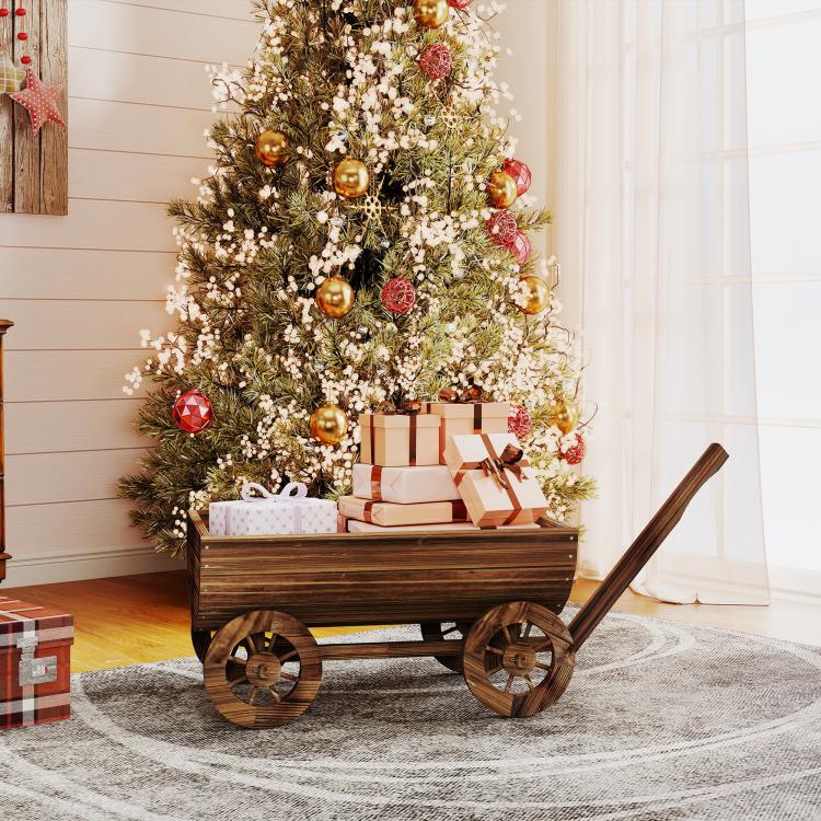 Wooden wagon planter box with four wheels and tall handle, open top