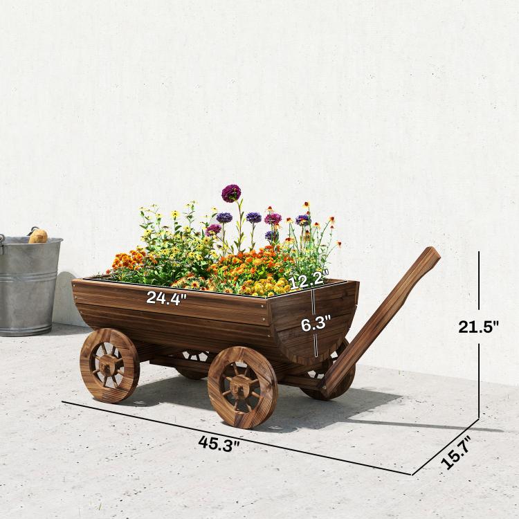 Wooden wagon planter box with flowers and four decorative wheel spokes; handle raised