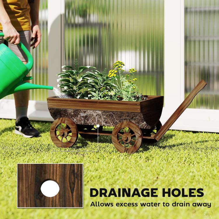 Wooden wagon planter box with four wheels and drainage holes in the bottom