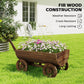 Fir-style wooden wagon planter box with flowers on four wheels and slanted handle