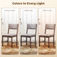 Dining chair with taupe fabric seat and brown wood frame, shown in three lighting shades