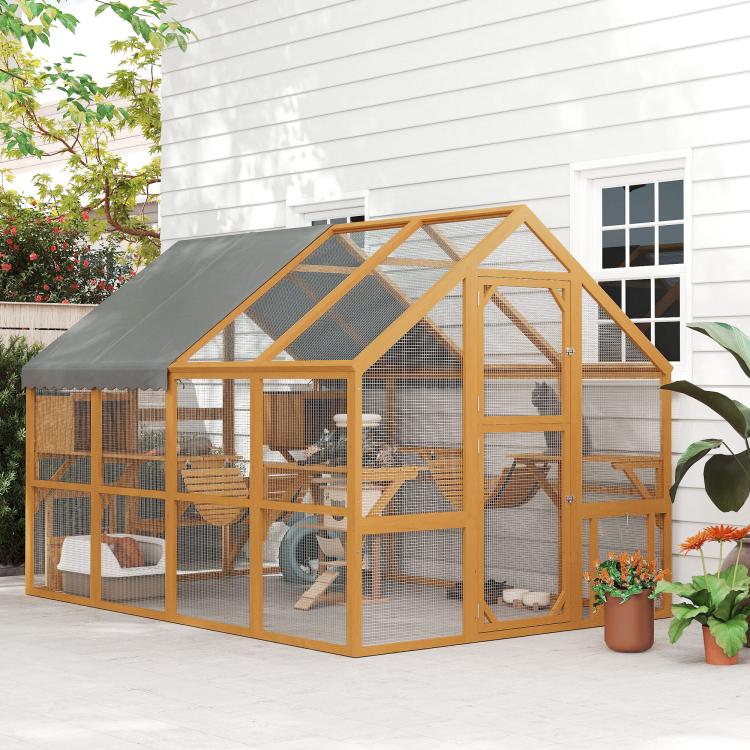 Wooden outdoor cat enclosure with gray top cover, wire mesh sides, and open activity sections