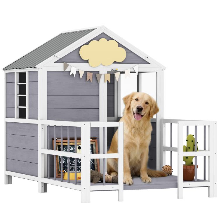 Outdoor wooden dog house with porch, gray siding, white railing, and dark roof.