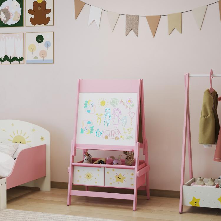 Pink kids double-sided art easel with whiteboard panel and storage drawers, standing indoors.