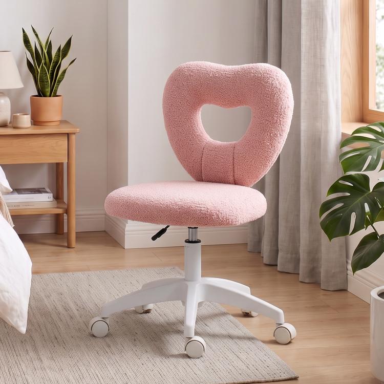 Pink armless swivel desk chair with heart cutout backrest, round padded seat, and caster wheels