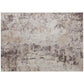 Abstract area rug close-up, light beige with brown and gray textured pattern