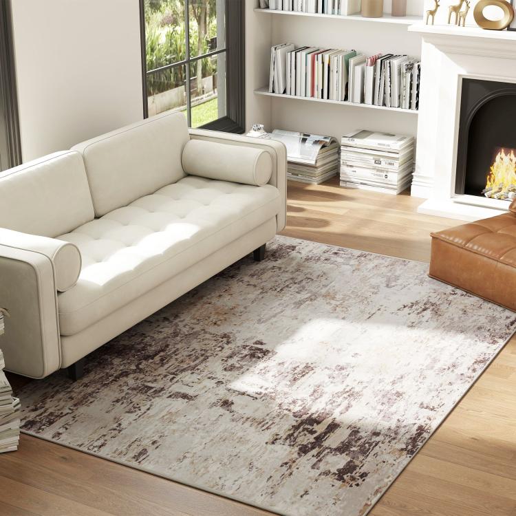 Abstract area rug in light tones with dark brown distressed pattern, 4x6
