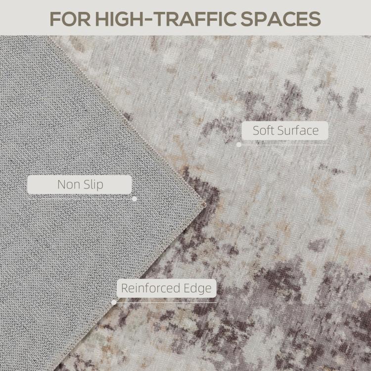 Corner detail of abstract area rug, light fabric texture with brown distressed print