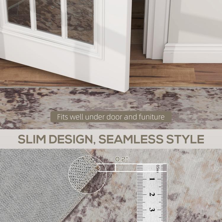 Abstract area rug edge detail near doorway, light base with brown distressed print