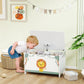 White and green kids toy storage chest with lion panel, open lid with plush toys