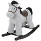 Gray plush rocking horse ride-on with blue eyes and brown saddle on black rockers