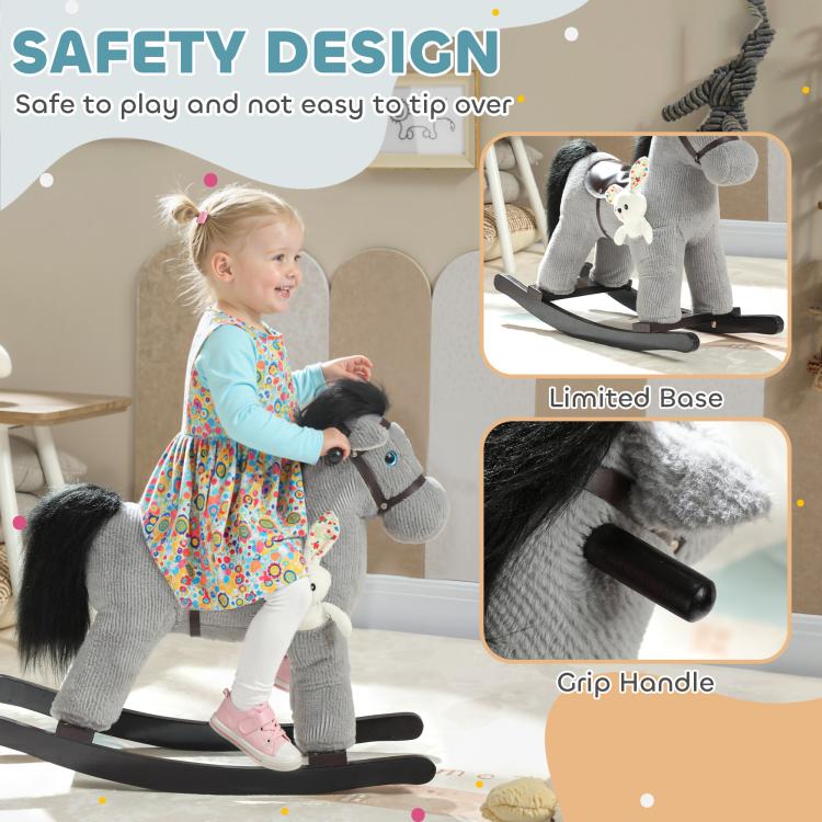 Gray plush rocking horse ride-on with bunny accessory, child holding the handle