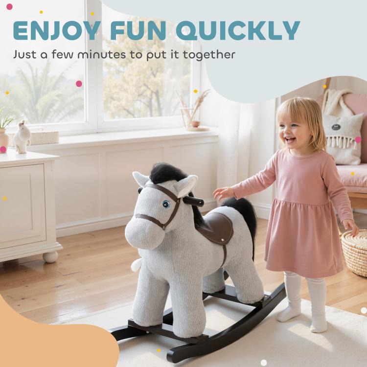 Gray plush rocking horse ride-on with brown saddle, toddler playing indoors