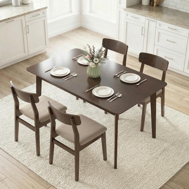 Rectangular dark brown dining table with four chairs and dinnerware centerpiece