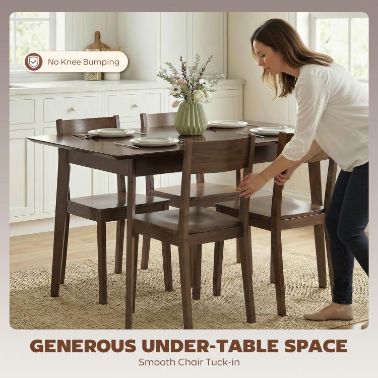 Brown dining table with four chairs, used for serving and seating