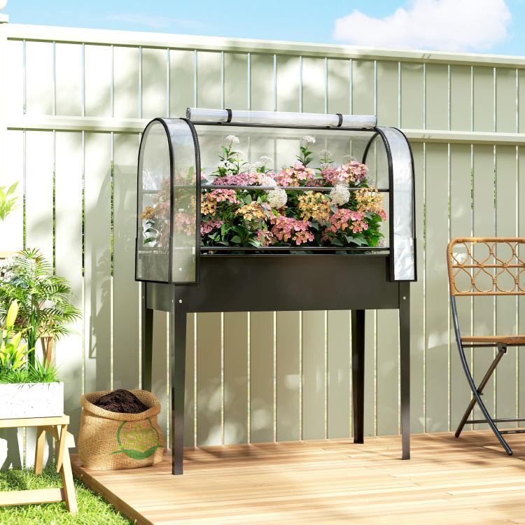 Black raised garden bed greenhouse cover with two front flip side panels and plants inside