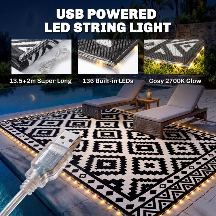 Black-and-white geometric outdoor rug with USB powered LED string lights