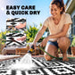 Outdoor black-and-white geometric rug shown being rinsed for quick dry