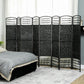 Black 8-panel room divider privacy screen standing folded with grid texture and metal frame