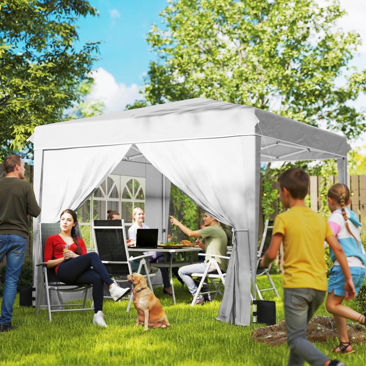 White pop-up canopy tent with sidewalls, set up for outdoor seating