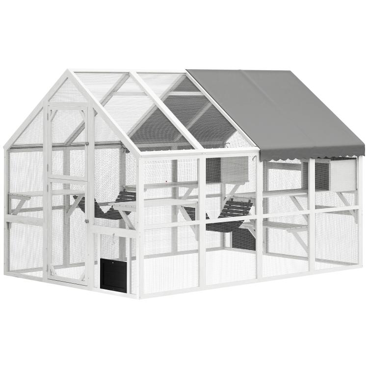 White outdoor wooden cat enclosure with gray roof and multi-level platforms