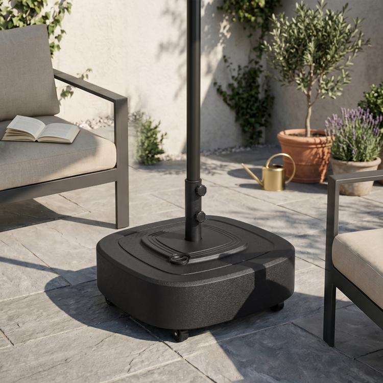 Umbrella base stand with wheels and circular top plate, pole inserted outdoors