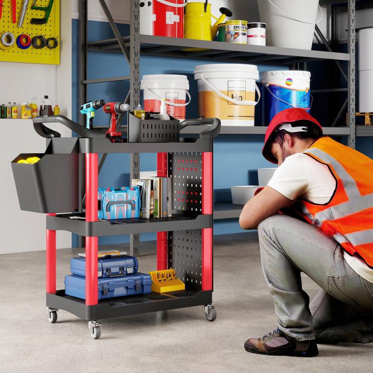 Black/red 3-tier rolling tool cart with side bucket and three open shelves in a workshop setting
