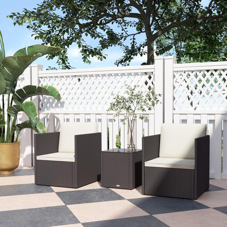 Wicker bistro set with two armchairs and square table, cream seat cushions