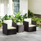 Outdoor wicker bistro set with two armchairs and square table, cream cushions