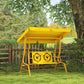Yellow kids swing chair with adjustable canopy and cartoon bear seat panel in yard