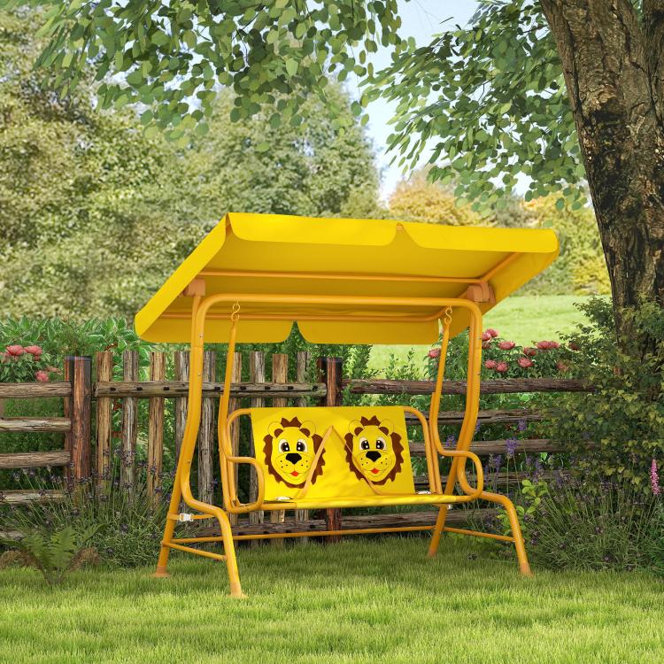 Yellow kids swing chair with adjustable canopy and cartoon bear seat panel in yard