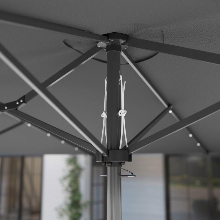 Gray double-sided patio parasol with LED string lights on underside ribs