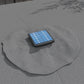 Solar LED panel on gray patio parasol canopy fabric