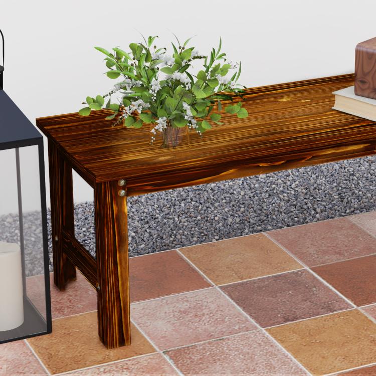 Corner view of backless wood garden bench with slatted top, dark brown finish