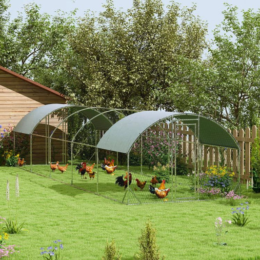 Outdoor chicken coop with white fabric canopy over arched wire enclosure and hens