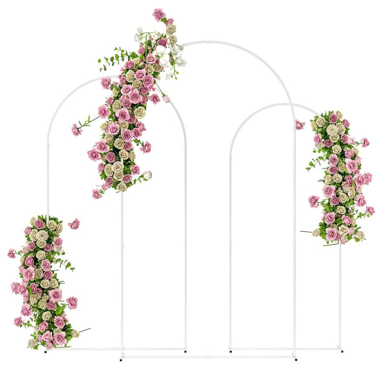 Three white metal backdrop arch frames with floral garlands and balloon accents