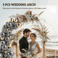 White metal backdrop arch frame with gray and gold balloons and pampas florals