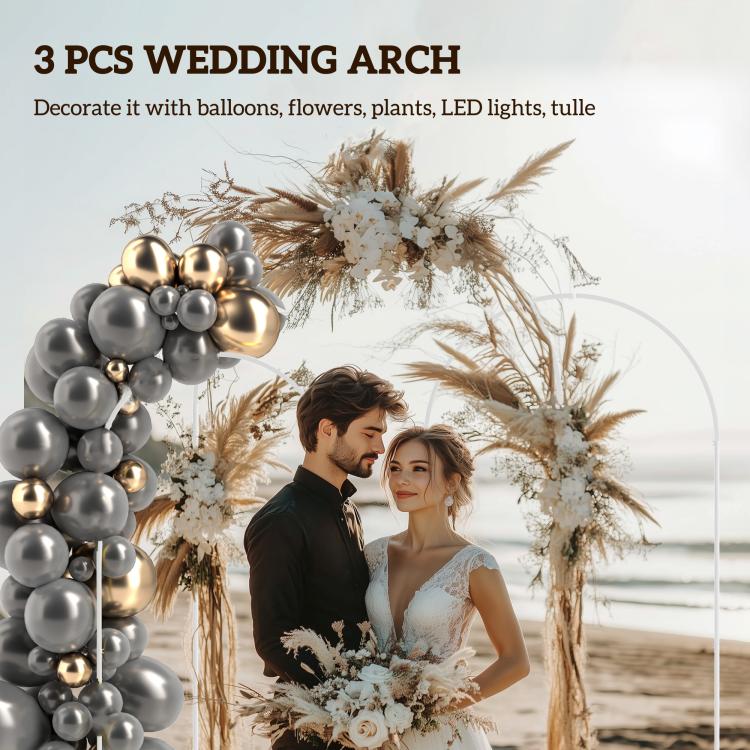 White metal backdrop arch frame with gray and gold balloons and pampas florals