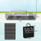 Folded outdoor rug with black/gray geometric print and carrying bag, size 6x9 ft shown