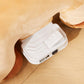 White power control unit with front ports on the underside of the plush ride-on pony
