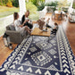 Reversible outdoor rug with blue and white geometric tribal pattern