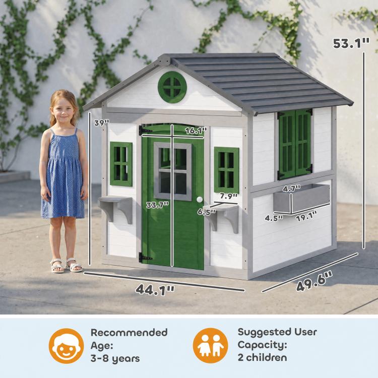 White wooden kids playhouse with green door and built-in windows, shown with size guide