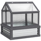 Gray raised garden flower bed with greenhouse cold frame and clear plastic panels